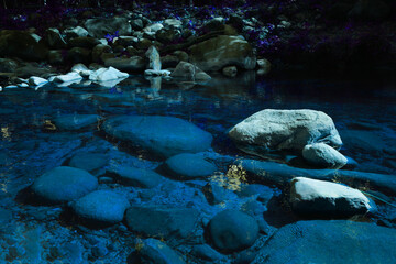 Fototapeta premium Big and small stones arranged naturally beautiful. in the waterfall area with blue water in the national park