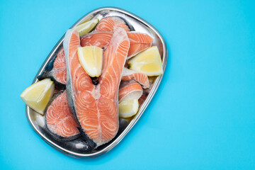 fresh raw salmon with lemon on the dish