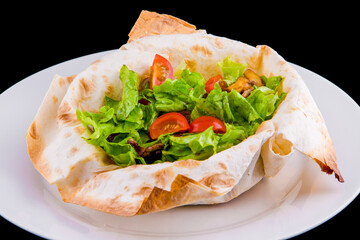 Warm salad in thin pita bread: beef, mushrooms, cherry tomatoes, Dijon mustard, cognac.