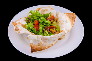 Warm salad in thin pita bread: beef, mushrooms, cherry tomatoes, Dijon mustard, cognac.