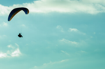 PARAGLIDING ON A SUNNY DAY