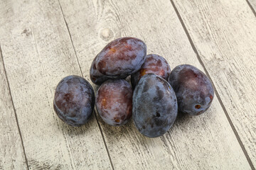 Purple sweet ripe plum heap