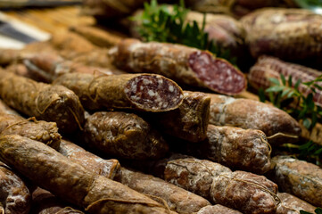 Italian salami and bacon, cured meat with bay leaf herbs