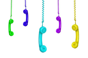 Many colorful vintage phones hanging