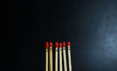 Group of a red match burning isolated with the background. Row burning matchstick in the chain reaction. Matchstick art photography.
