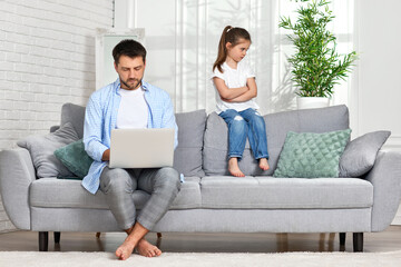 offended little child daughter and father while he working