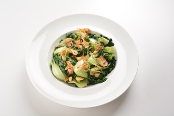 stir fried vegetable nai bai with garlic and mushroom in oyster sauce in white plate asian halal menu