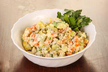 Russian traditional salad with green peas