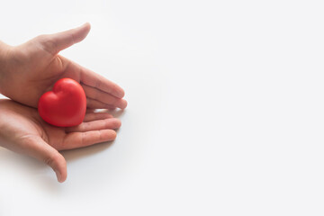 red heart in hand.social responsibility concept.family,health and life insurance concept.organ donation,world heart health day.cardiology day.