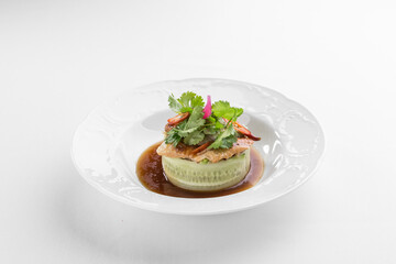 Starter plate with eel, quinoa and cucumber isolated on white background