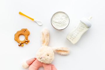 Obraz na płótnie Canvas Powdered baby milk and milk formula in bottle