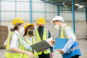 Teamwork engineer in uniform wear protection mask brainstorming workshop industrial factory building. meeting worker team.