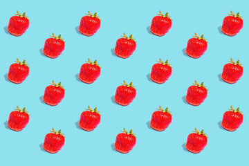 Pattern from strawberries on a colored background