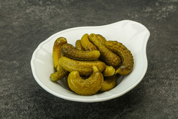 Pickled gherkin in the bowl