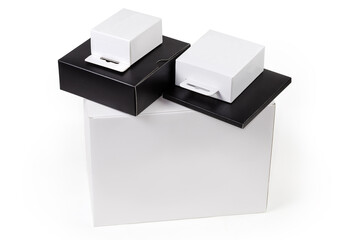 White and black rectangular cardboard packing boxes different sizes