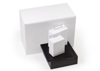 White and black rectangular cardboard packing boxes different sizes