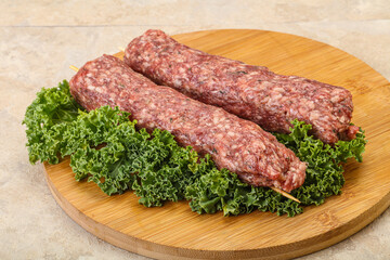 Raw minced beef kebab skewer