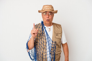 Senior american fisherman holding net isolated on white background having some great idea, concept of creativity.