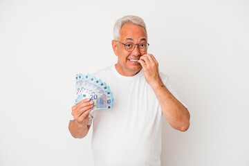 Senior american man holding bill isolated on white background biting fingernails, nervous and very anxious.