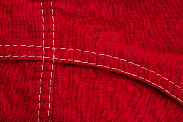 a fragment of a sewing product, clothing made of natural linen and cotton, a double seam, the connection of parts with machine stitching