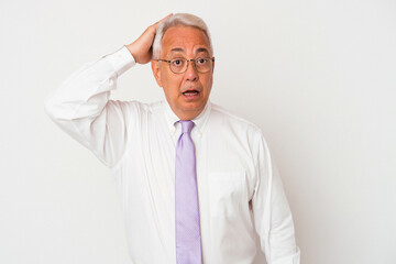 Senior american man isolated on white background being shocked, she has remembered important meeting.