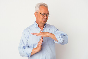 Senior american man isolated on white background showing a timeout gesture.