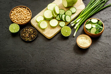 Cooking salad with green vegetables and chickpea in bowl