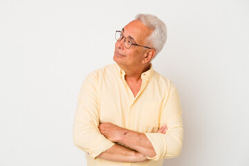 Senior american man isolated on white background dreaming of achieving goals and purposes