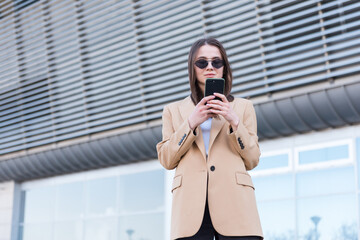 Business woman talking on smart phone. Business people office worker talking on smartphone smiling happy. Young multiracial caucasian female professional outside.