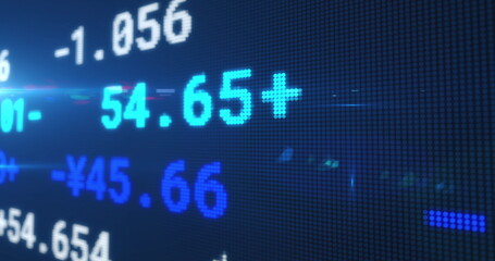 Image of stock exchange display board with numbers changing on blue