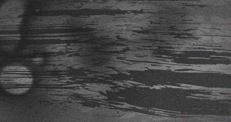 Image of multiple grey smudges and spots moving on seamless loop