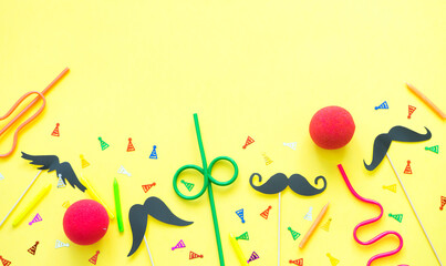 Festive composition of candles, cocktail tubes, carnival accessories