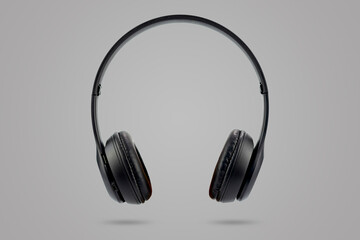 Fototapeta na wymiar Modern design of black color wireless earphones isolated on gray color pastel background.