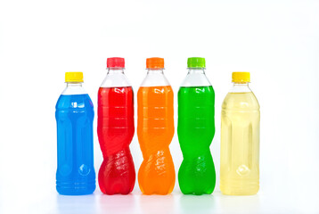 Multi colored drinks in plastic bottles isolated on white background.