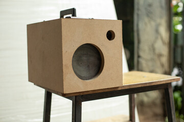 The speaker is in the box. A homemade speaker with amplified sound.