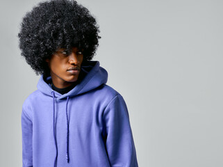 Portrait of black man in hoodie with circle afro hairstyle - obrazy, fototapety, plakaty