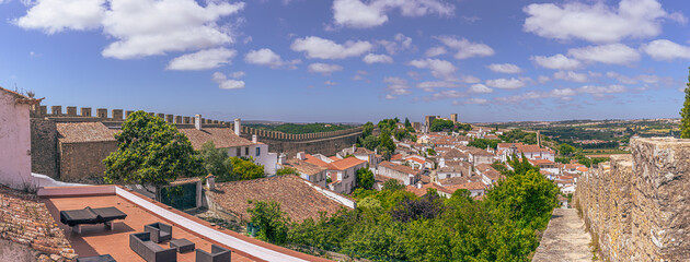 Fototapeta na wymiar Óbidos - June 29, 2021: Panoramic view of the medieval town of Óbidos, Portugal