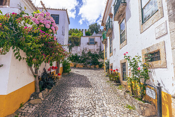 Óbidos - June 29, 2021: Street view of the medieval town of Óbidos, Portugal