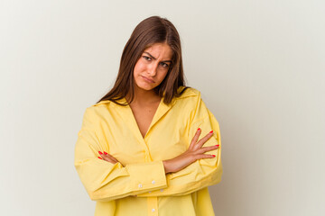 Young caucasian woman isolated on white background blows cheeks, has tired expression. Facial expression concept.