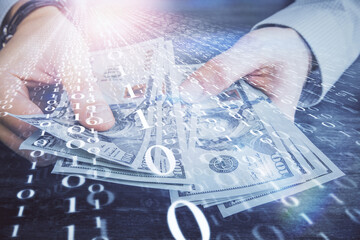 Multi exposure of technology drawing hologram and us dollars bills and man hands. Data concept