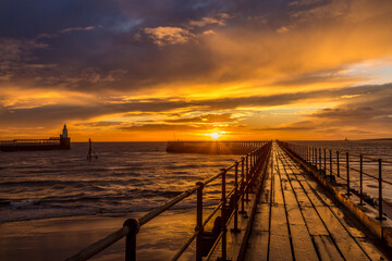 A glorious morning at Blyth beach, with a beautiful sunrise over the old wooden Pier stretching out to the North Sea