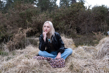 Portrait of a woman in the countryside sitting