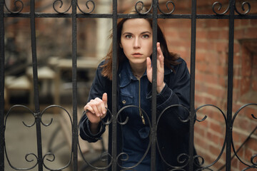 Young woman is hiding away from someone.