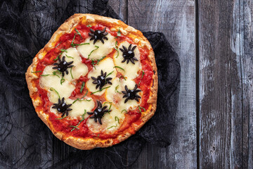 Ideas for Halloween. Margarita Pizza with olives spiders.