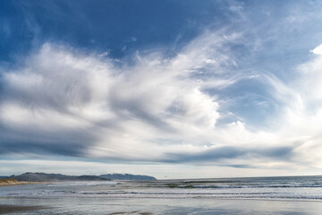 view on beach with sea or ocean water. cloudy sky and seascape nature.