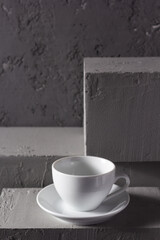 Empty cup of coffee on concrete grey abstract background texture. Coffee as break concept