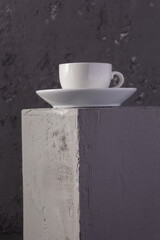 Empty cup coffee on concrete grey cube as  background texture.  Abstract concept of break coffee time