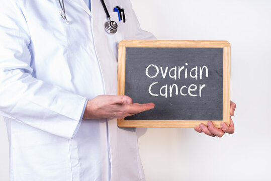 A doctor with a blackboard Ovarian Caner writte on it.