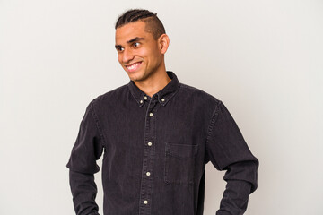 Young venezuelan man isolated on white background dreaming of achieving goals and purposes