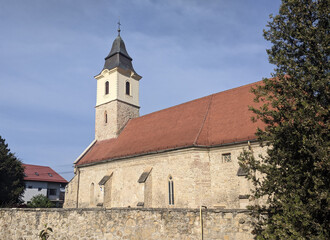 Fototapeta na wymiar Roman Catholic Church with fortress walls from Floresti, Cluj